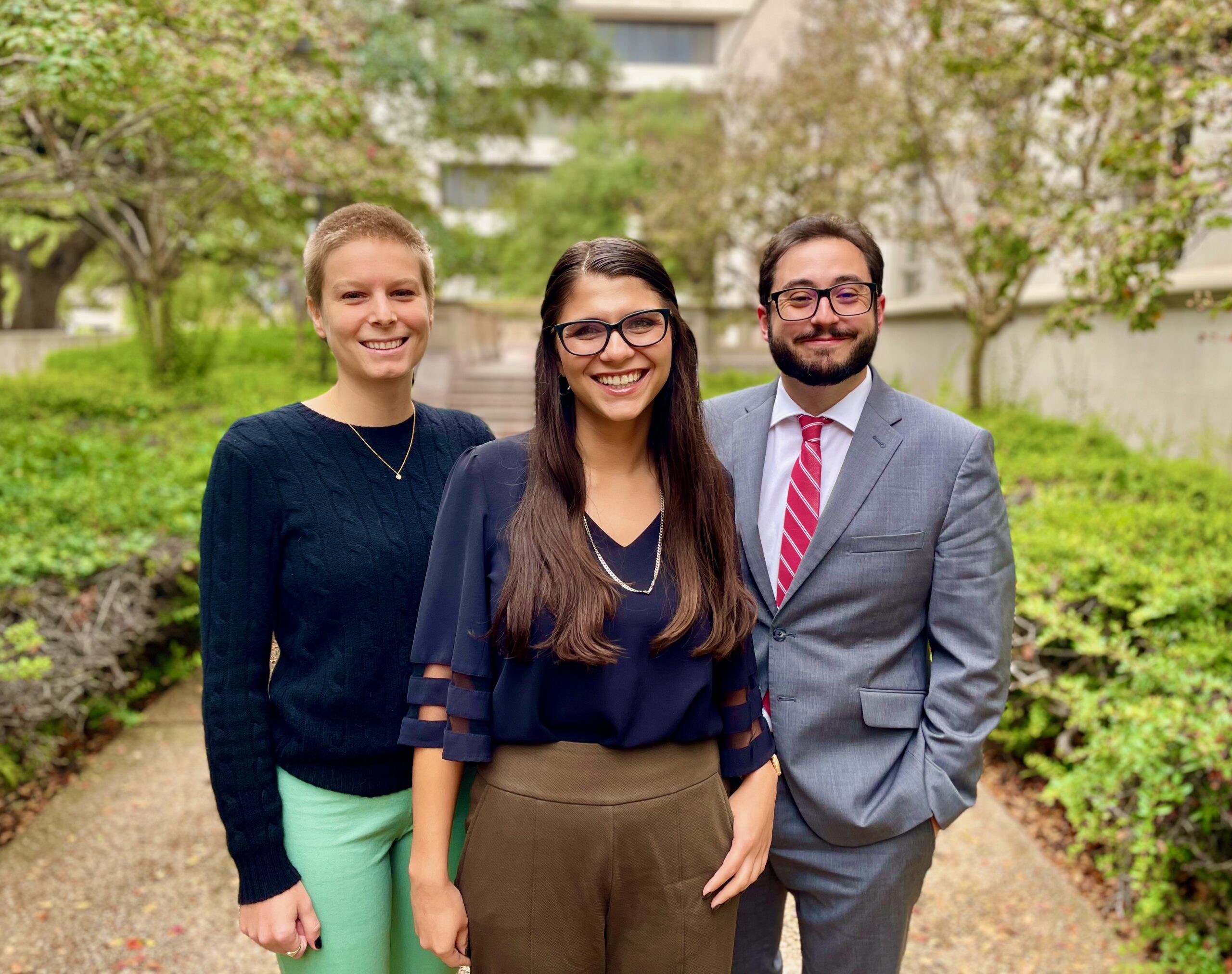 Three students smiling