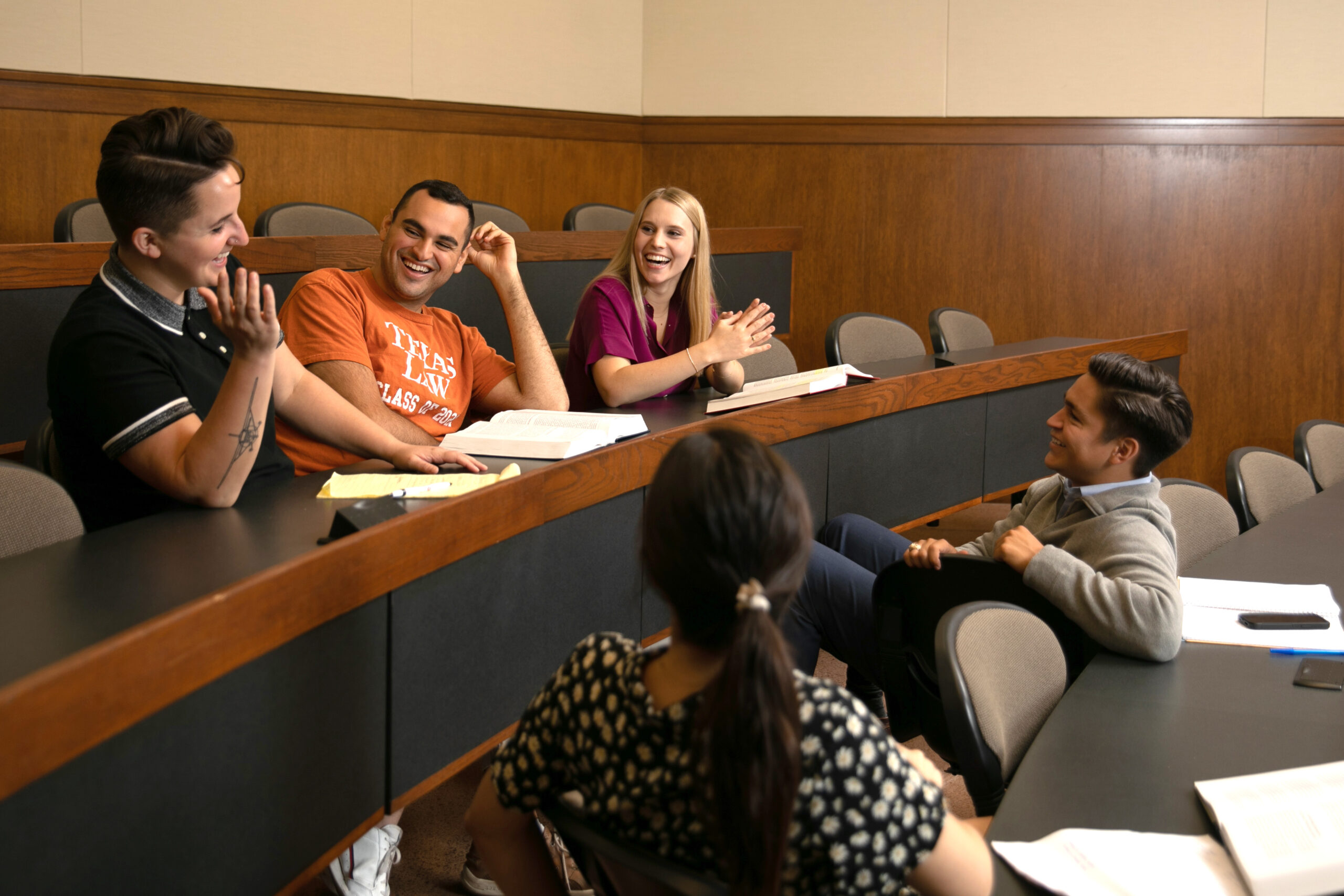 students sitting and talking casually in a classroom