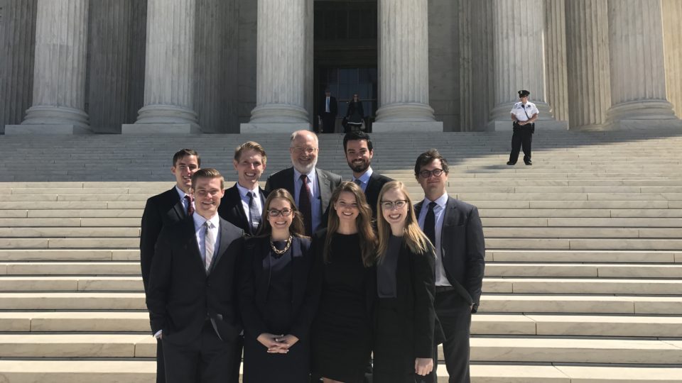 Students stand on steps of Supreme Court