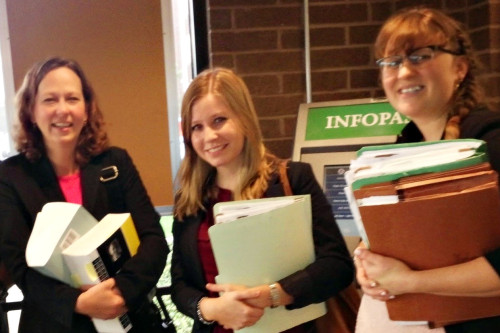 Denise Gilman and student attorneys outside of USCIS offices following a client's naturalization interview. 