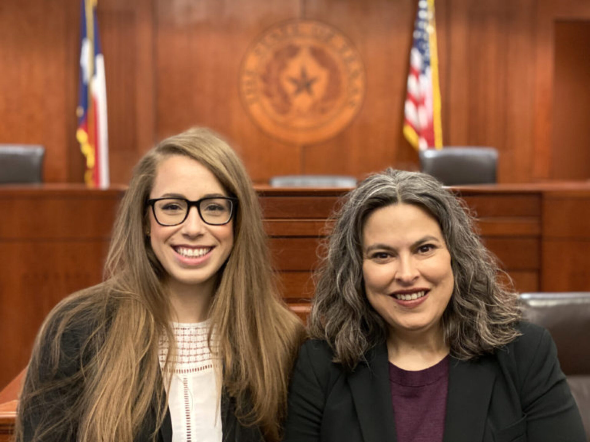 Student and professor sit in a courtroom