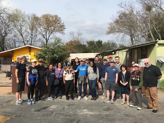 Clinic students touring the North Lamar Mobile Home Park with members of the newly formed Asociación de Residentes North Lamar Corporation