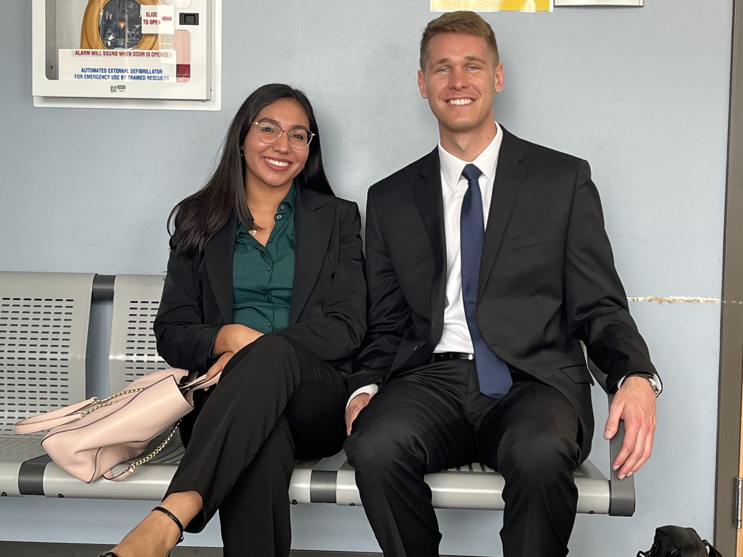 Criminal Defense students sit outside a pre trial hearing