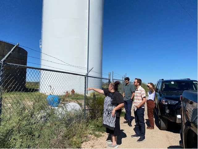 Clinic student and client examine water treatment facility in Toyah, TX.