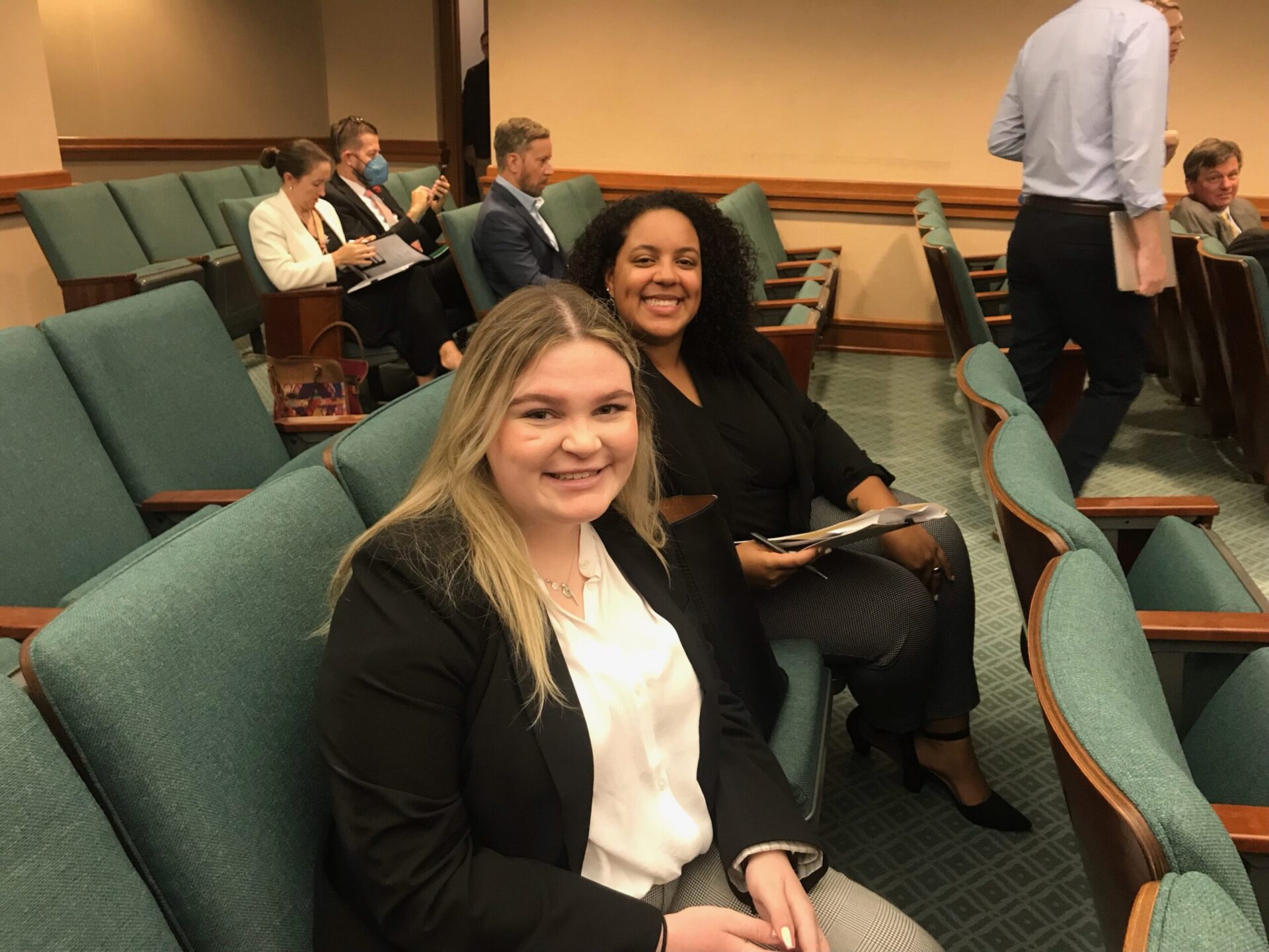 Student sits in court with the supervising attorney for her internship.
