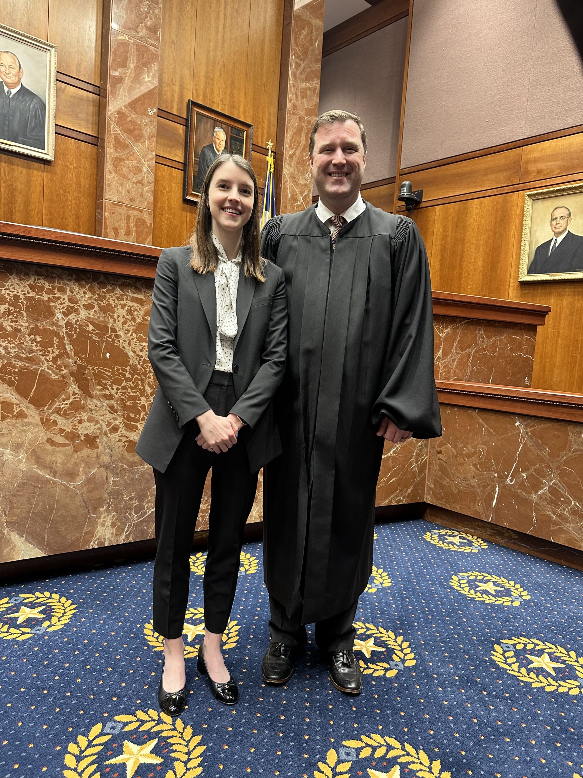 Internship student with judge at her placement.