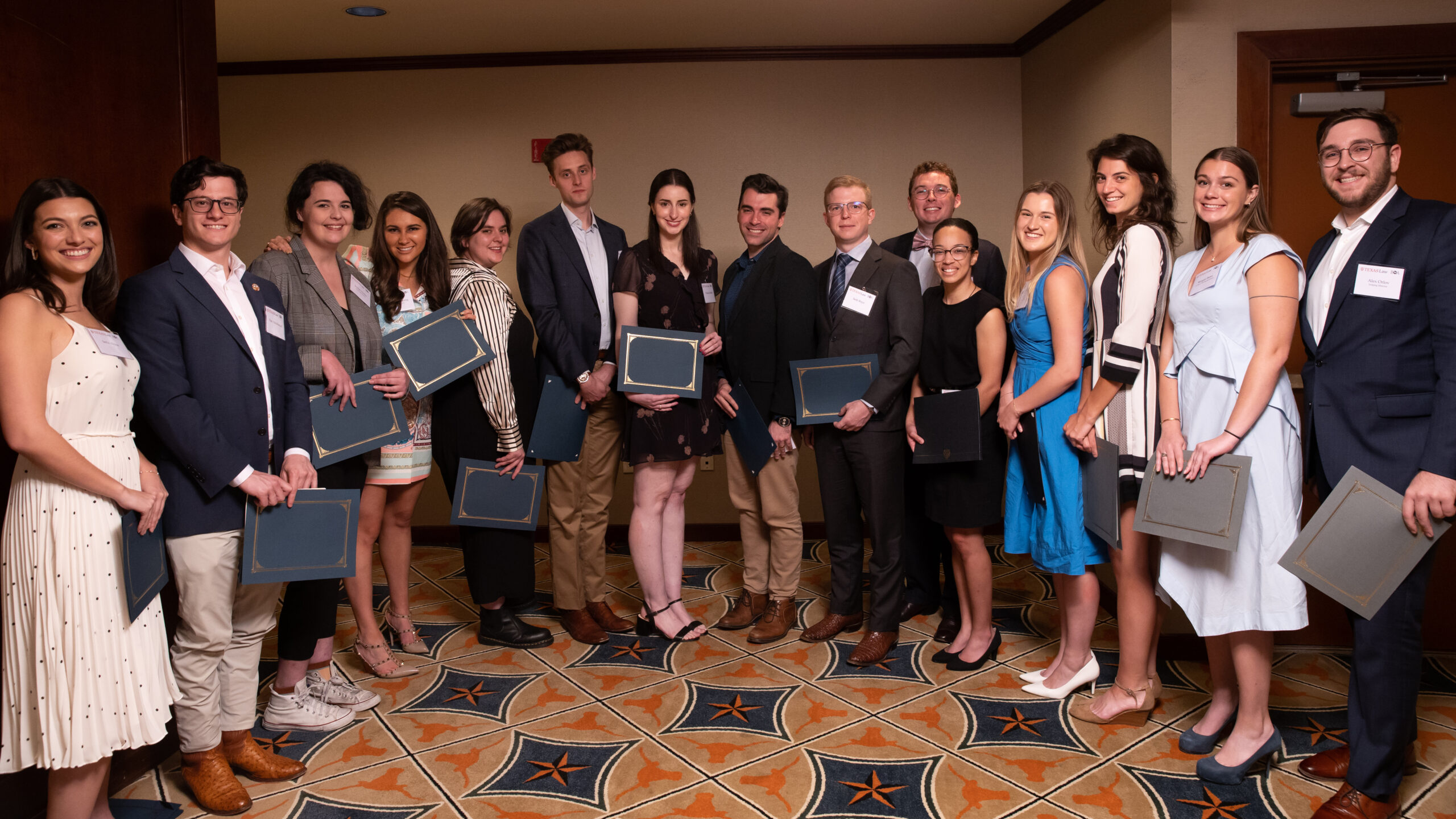 Scholarship recipients pose for a photo with their certificates at the 2023 Board of Advocates Banquet