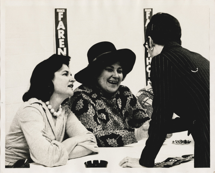 Photograph of of Frances "Sissy" Tarlton Farenthold and Bella Abzug with Farenthold campaign signs in background.