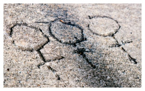 female symbol etched into concrete