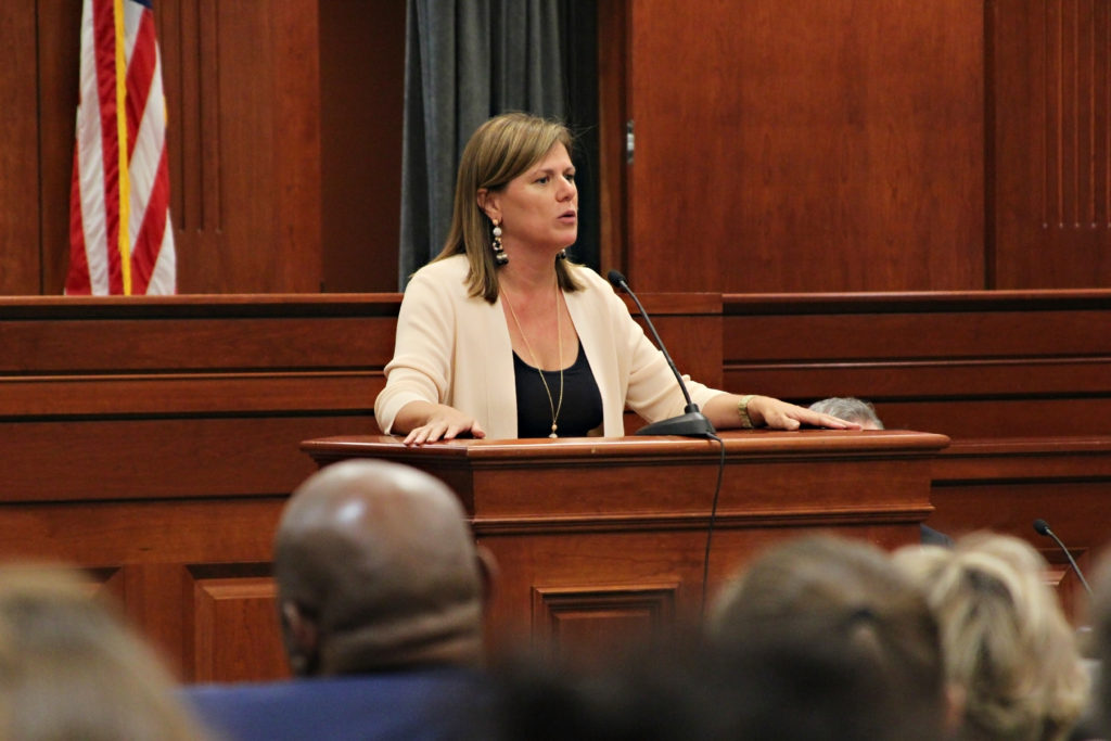 Patricia Cummings speaking at podium