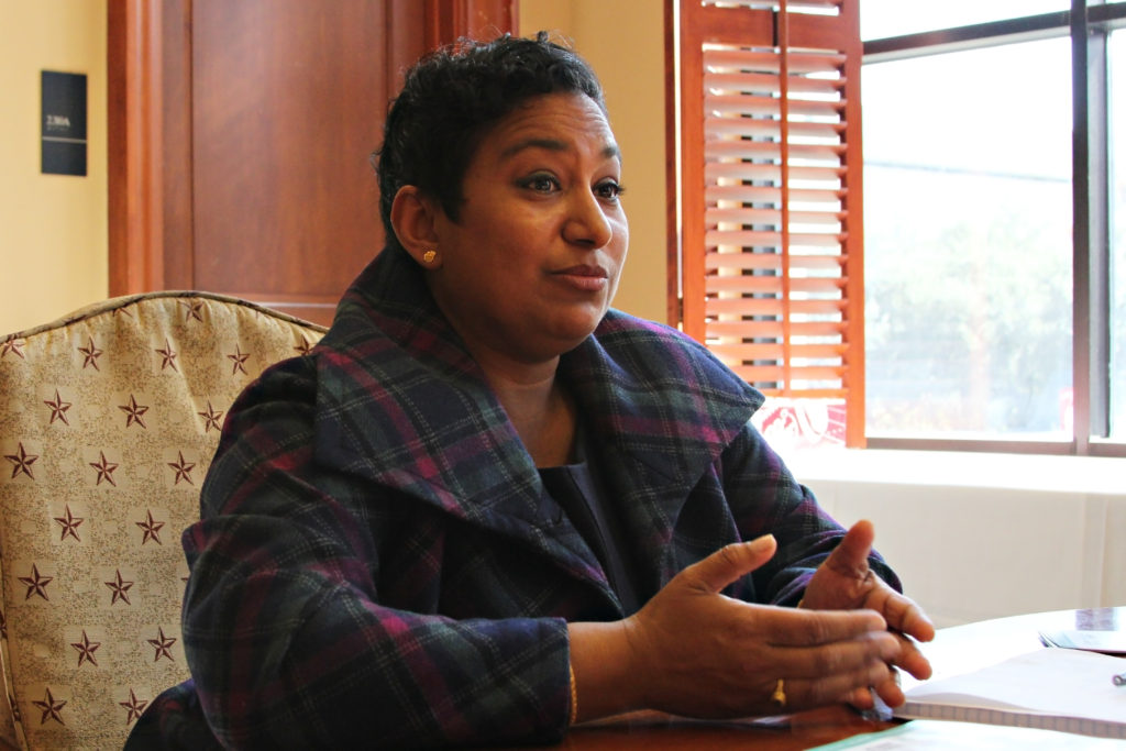 Sunu Chandy seated at table