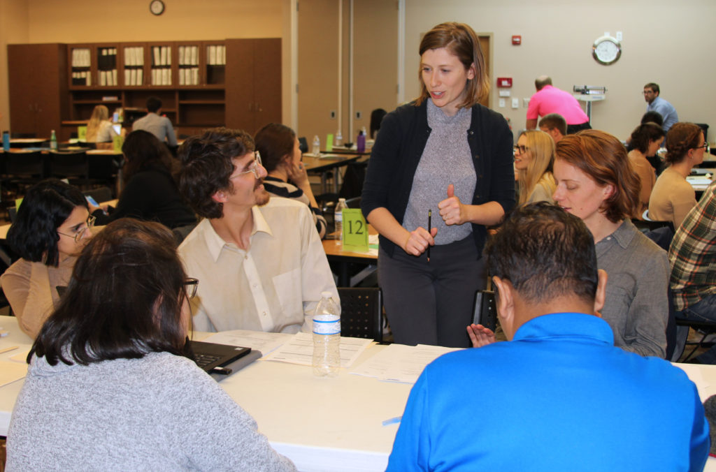 students and alumna at legal clinic