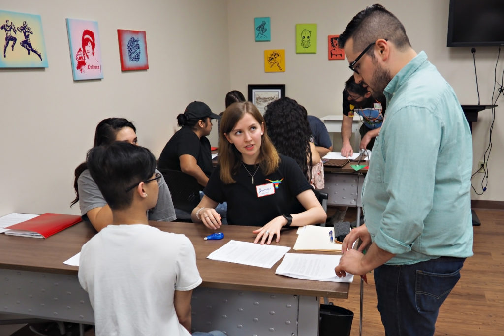 Attorney Cristian Sanchez with student volunteers