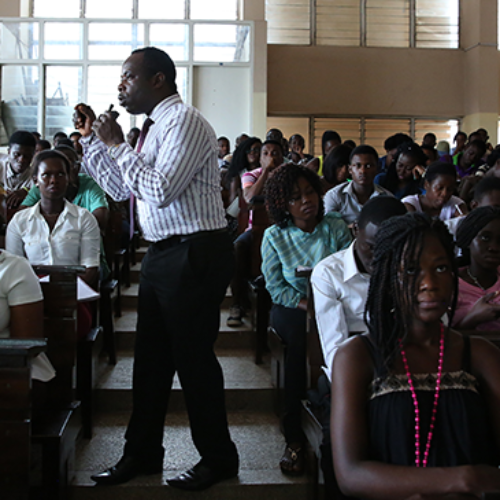 man speaking to students
