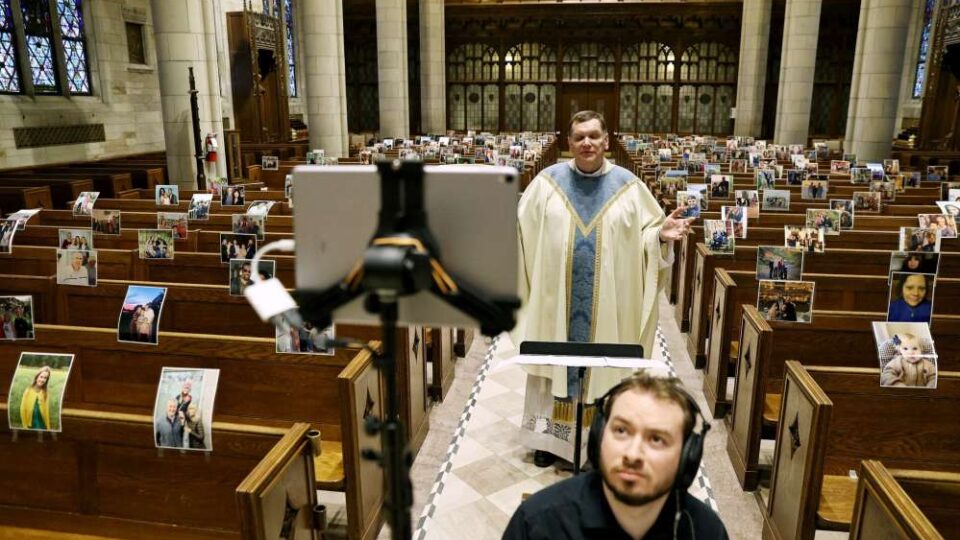 A priest live-streaming a church service during COVID-19