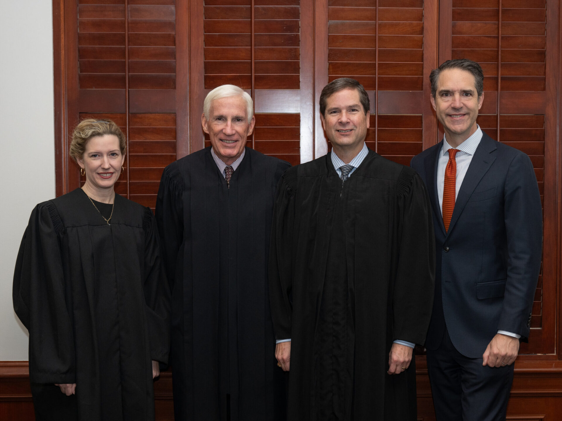 Justice April Farris, Chief Justice Scott Brister, Justice Scott Field ’95, and Dean Bobby Chesney