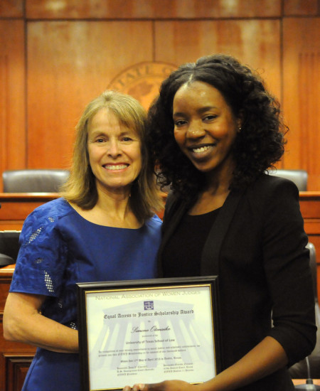 Judge Orlinda Naranjo, left, stands with Simone Otenaike, ’15, winner of the National Association of Women Judges District 11 Access to Justice Scholarship, at the Color of Justice event at the Law School on April 17, 2013.