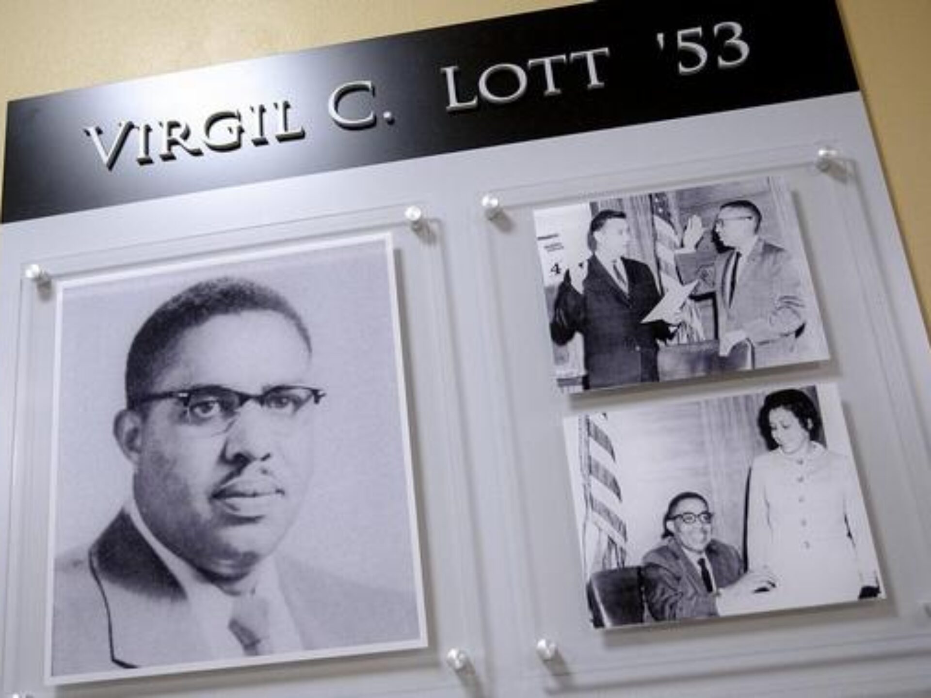 Three photos in wall plaque honoring Virgil C. Lott '53