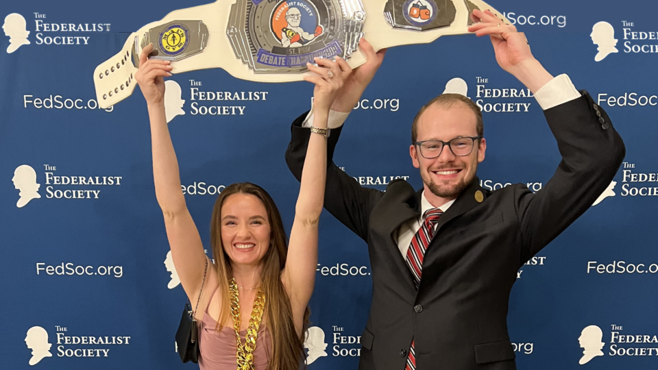 Texas Federalist Society members hold up their award