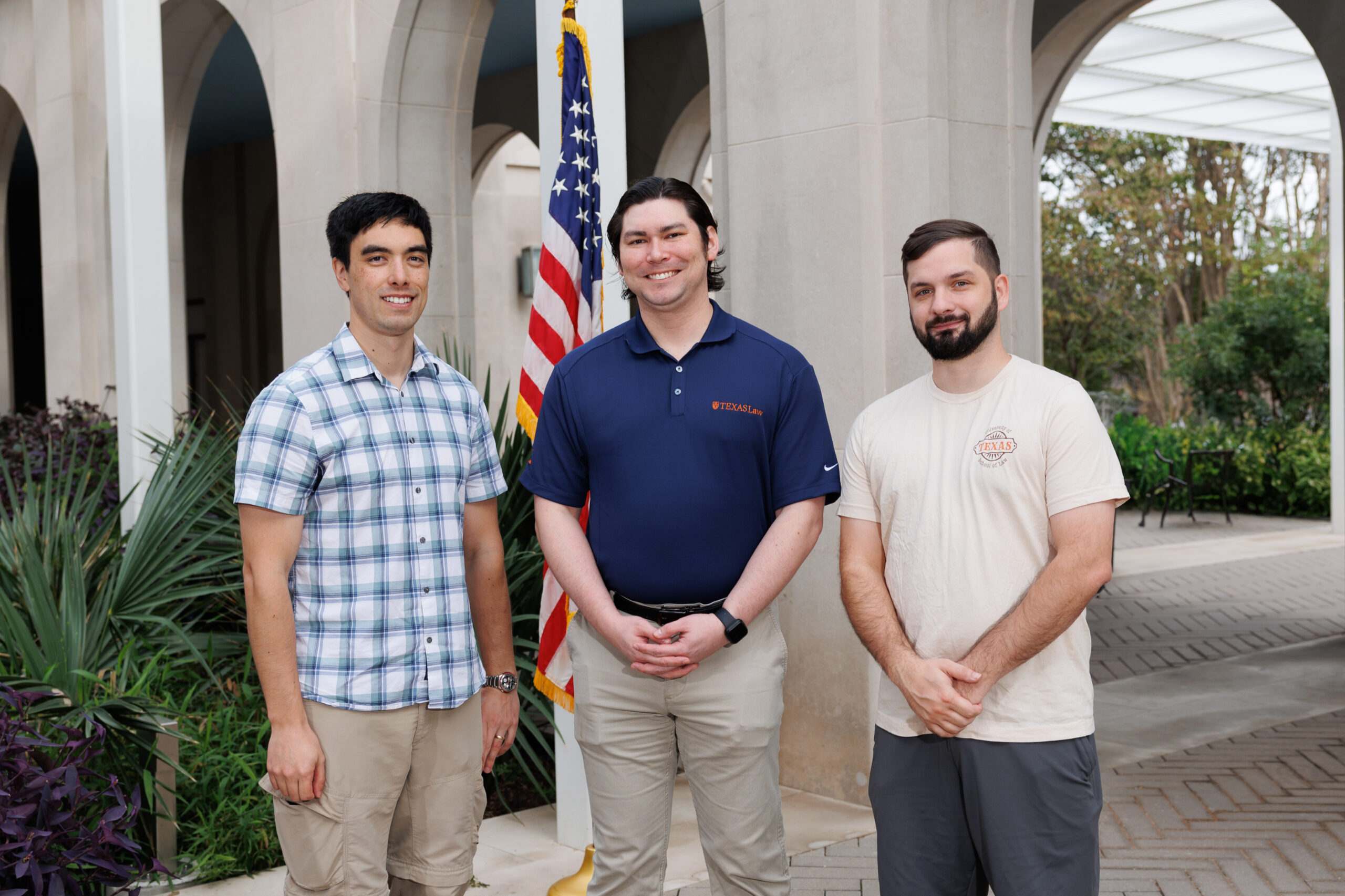 The TLVA leadership for the 2023-24 academic year, Social Coordinator Stephen See '24, President Thomas Rielly '25, and Finance Director James Ticknor '25, stand side by side by side in the law school courtyard