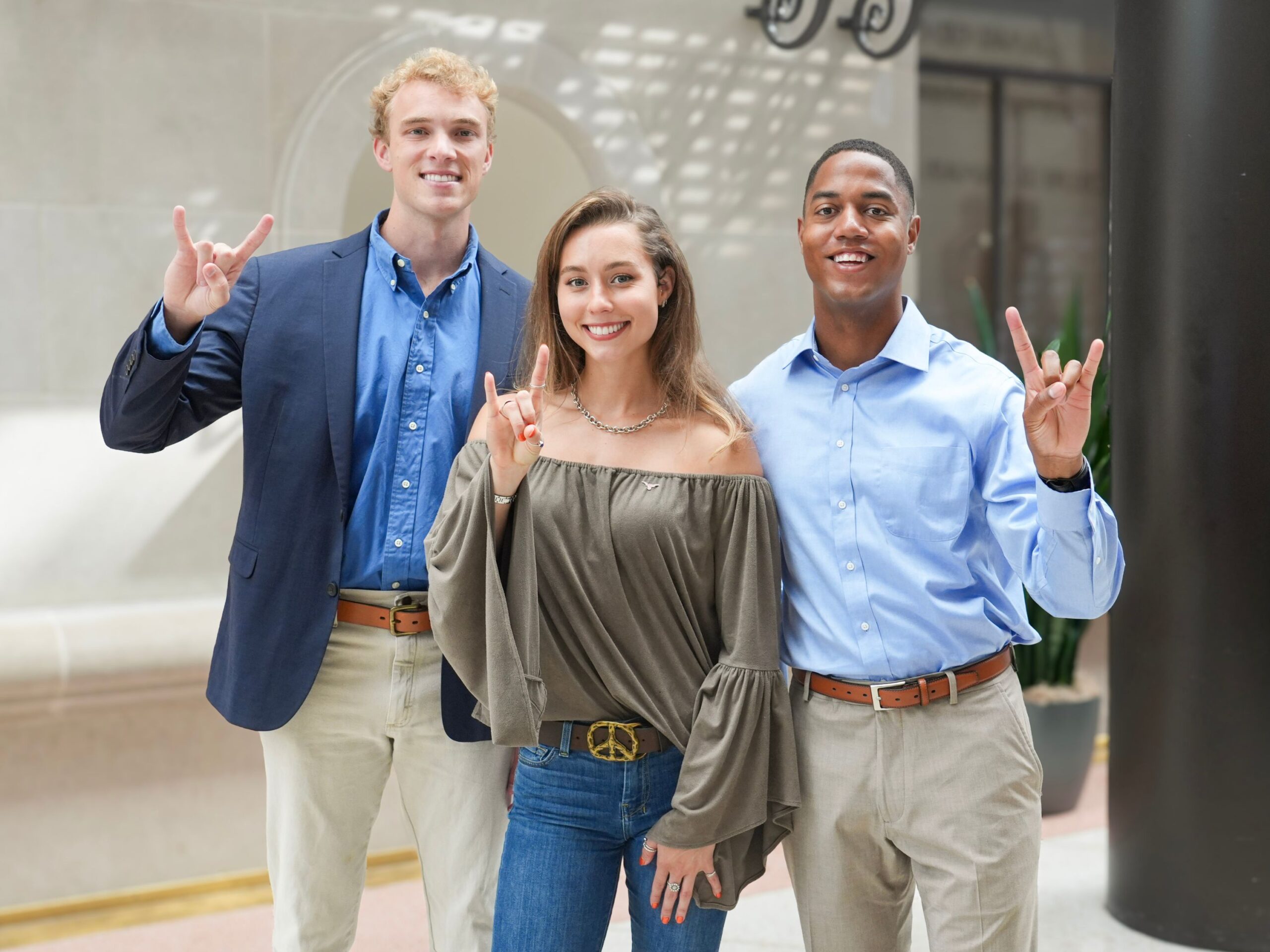 Cooper Tyler, Chandler Lawn, and Joe Holden pose in the law school