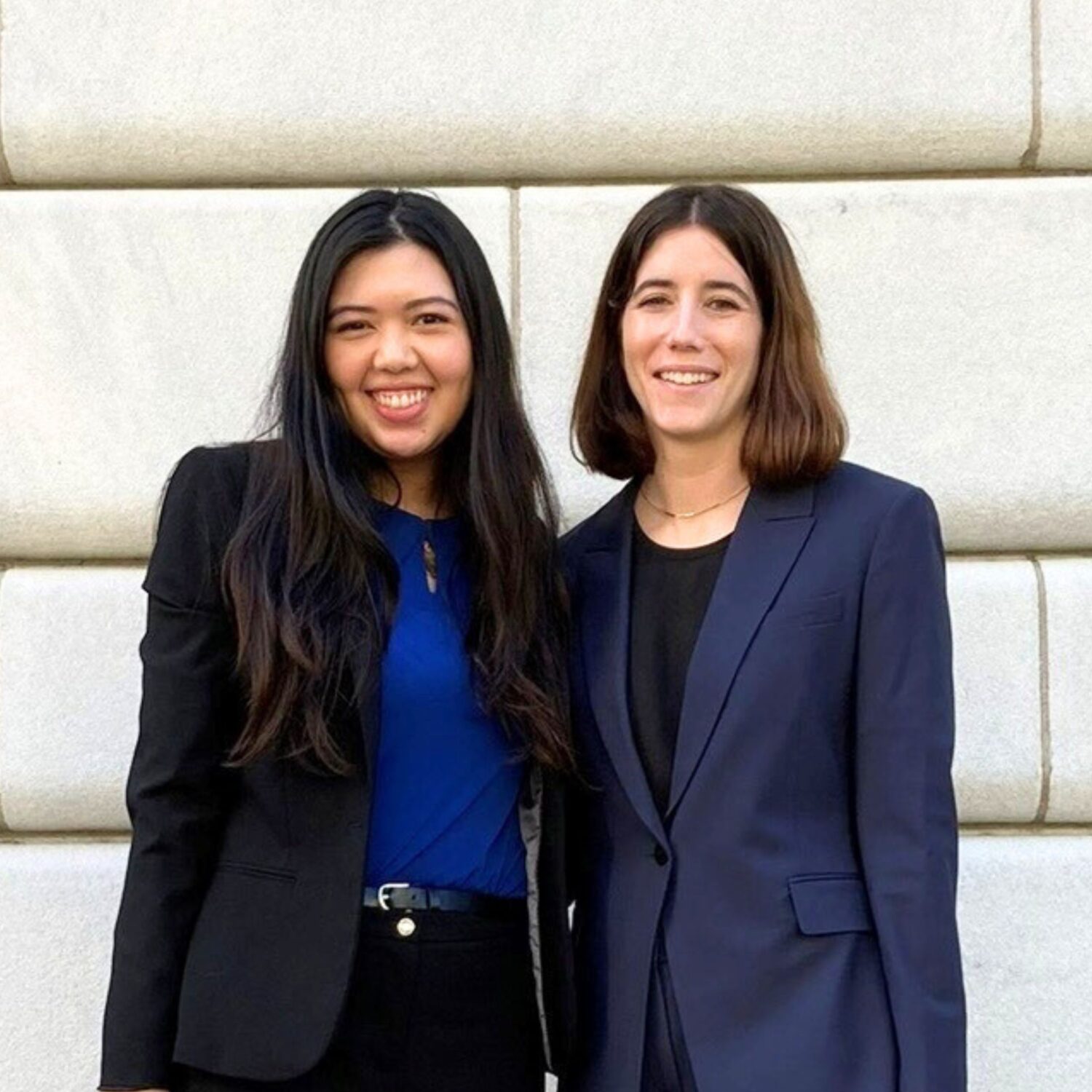 Too women in suits standing outside courthouse - Lisette Chan ’24 and Annie Fogel ’24