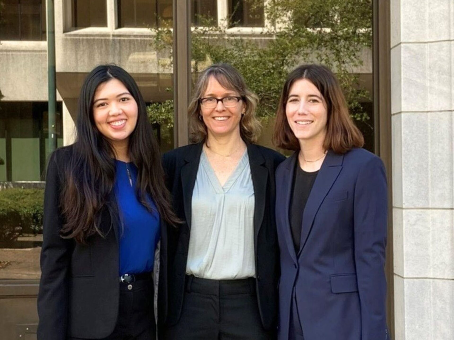 Three women standing outside court building. Lisette Chan ’24, Professor Elissa Steglich, and Annie Fogel ’24