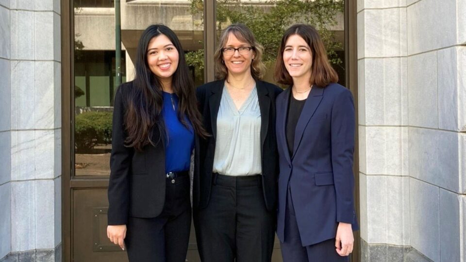 Three women standing outside court building. Lisette Chan ’24, Professor Elissa Steglich, and Annie Fogel ’24