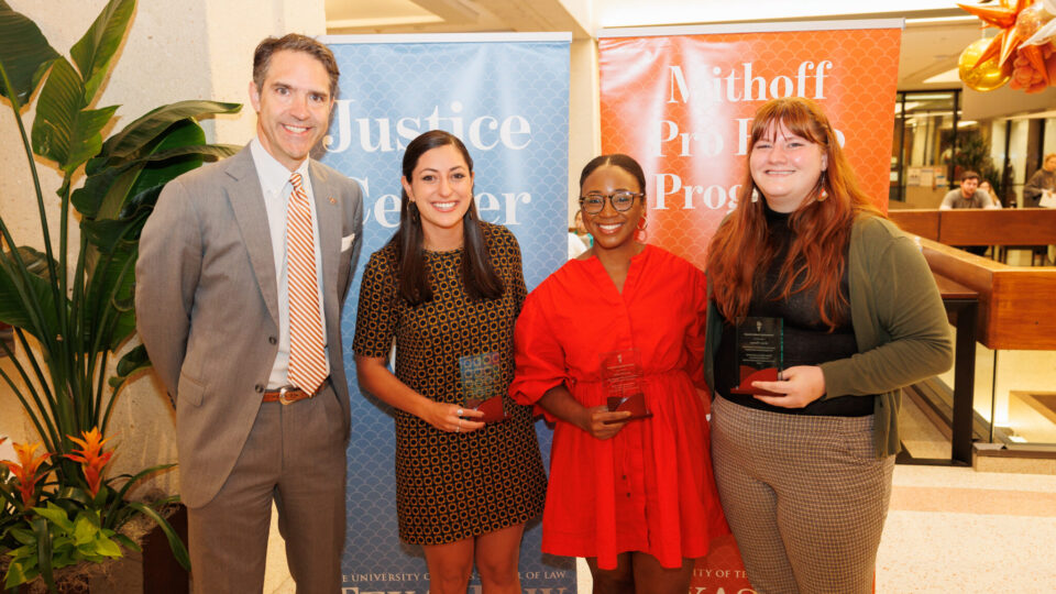 Dean Bobby Chesney presented Lea Kokenes, Alyse Munrose, and Grace Thomas with their awards at the annual Celebration of Service.