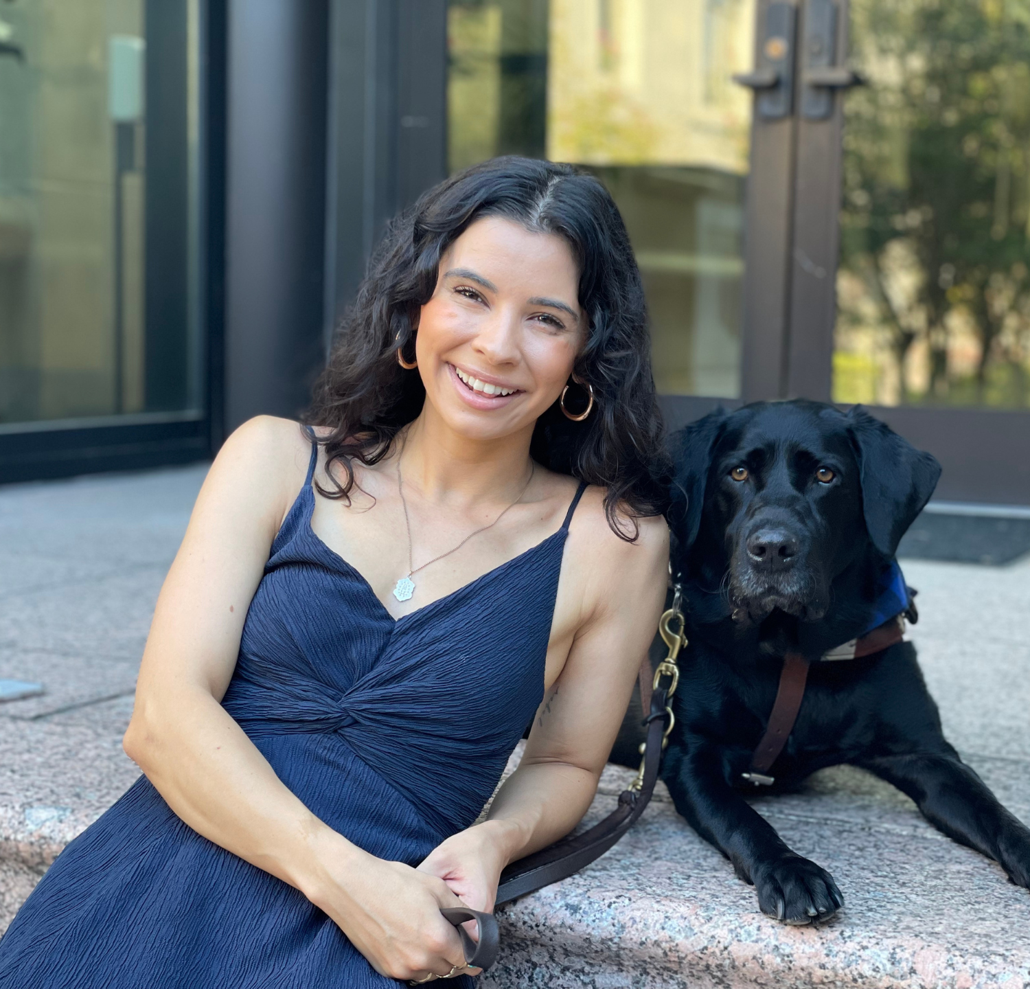 Headshot of Emily Eagle and her canine companion, Rebel