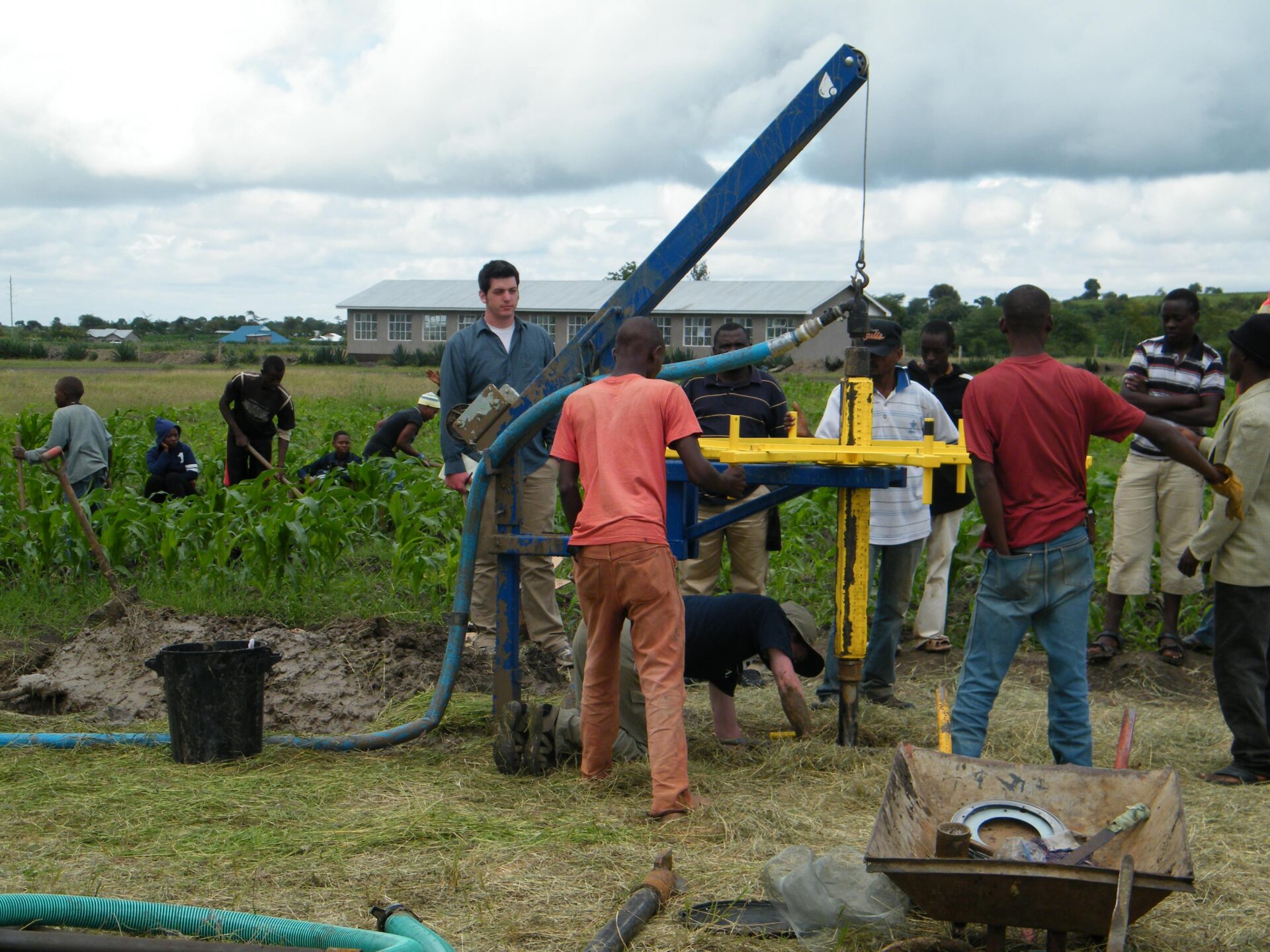 Large drill in Tanzania surrounded by Ken Langley and associates