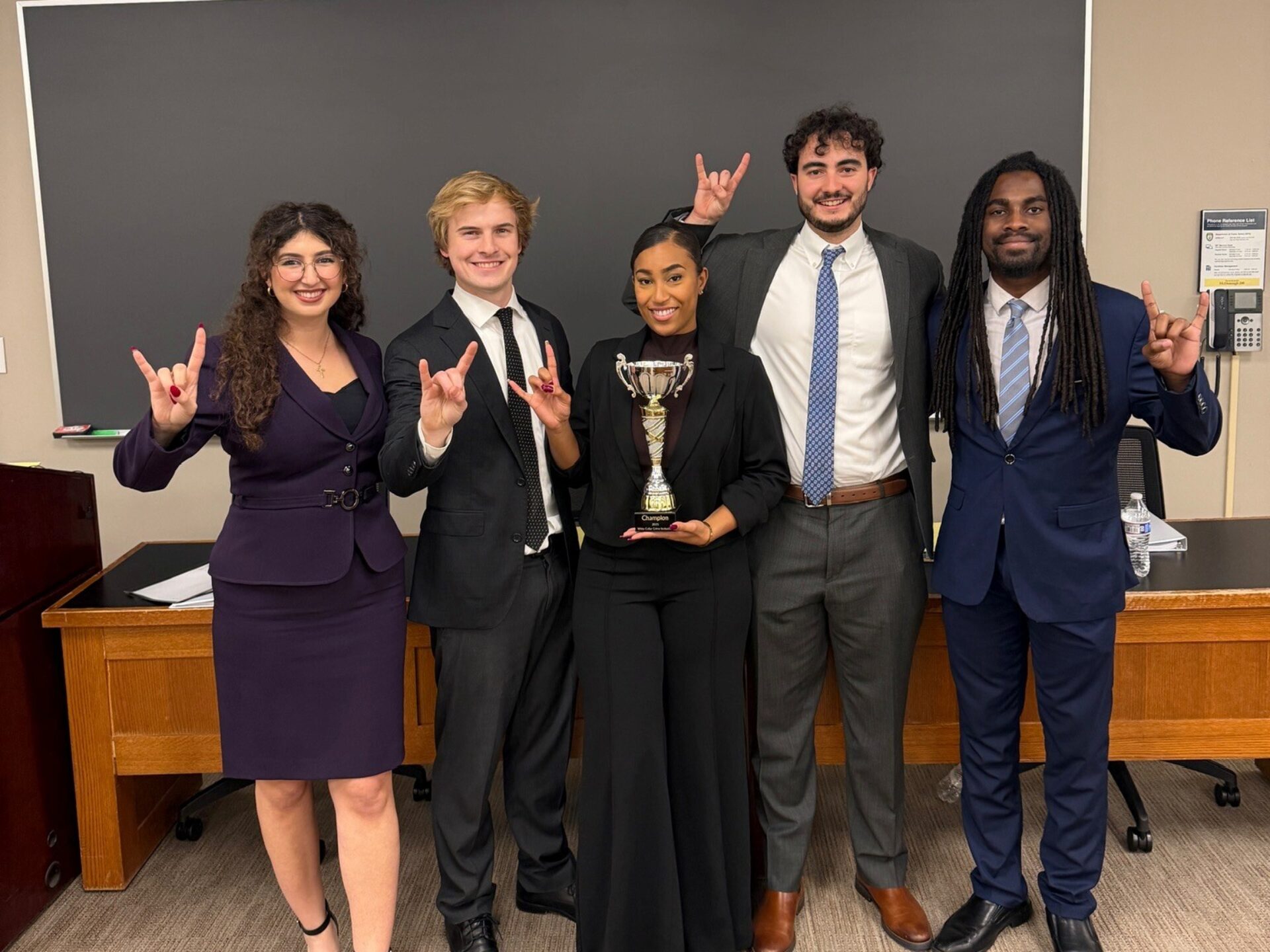 Photo of Josianne Alwardi, Nickoli Benkert, Raychel Polk, Michael Blaine, and Cortez Walters at the Georgetown White Collar Crime Invitational
