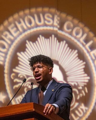 man speaking at podium