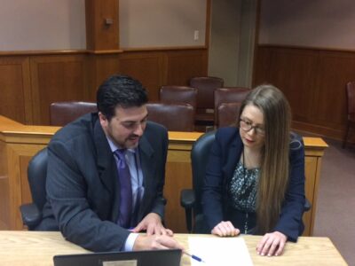 Student lawyers prepare for a court appearance on behalf of their clients in the Juvenile Justice Clinic of Texas Law.