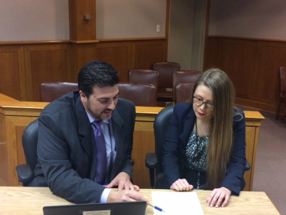 Student lawyers prepare for a court appearance on behalf of their clients in the Juvenile Justice Clinic of Texas Law.