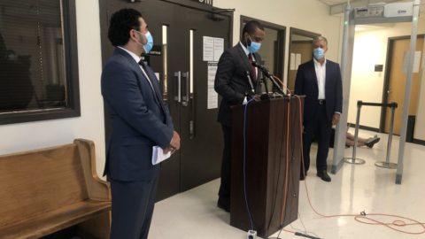 Harris County recovery czar Armando Walle, Judge Jeremy Brown, and Houston recovery czar Marvin Odum deliver an update outside of a courtroom