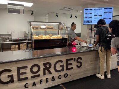 Customers ordering at George's Cafe counter