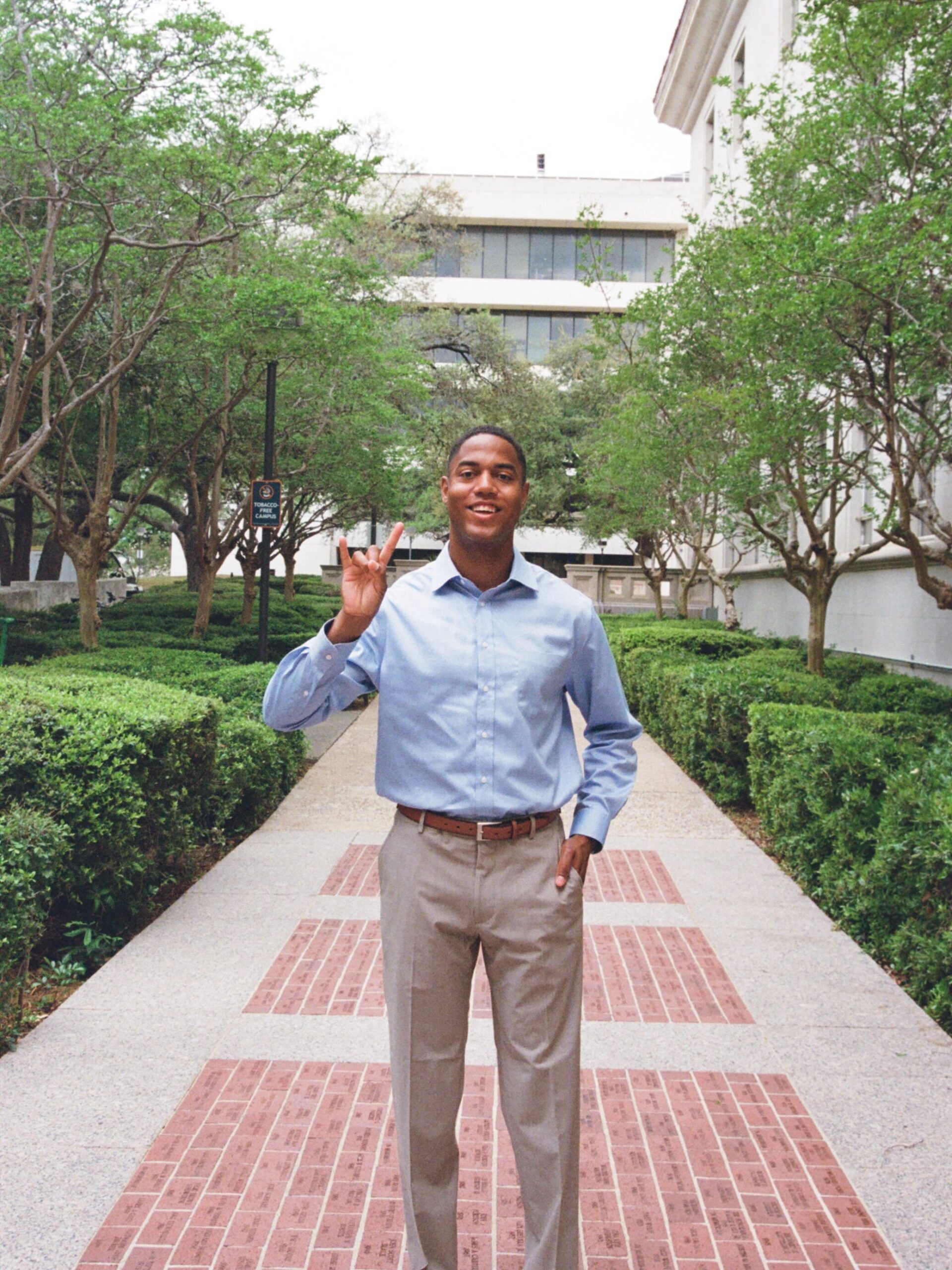 Joe Holden holding Hook 'em hands