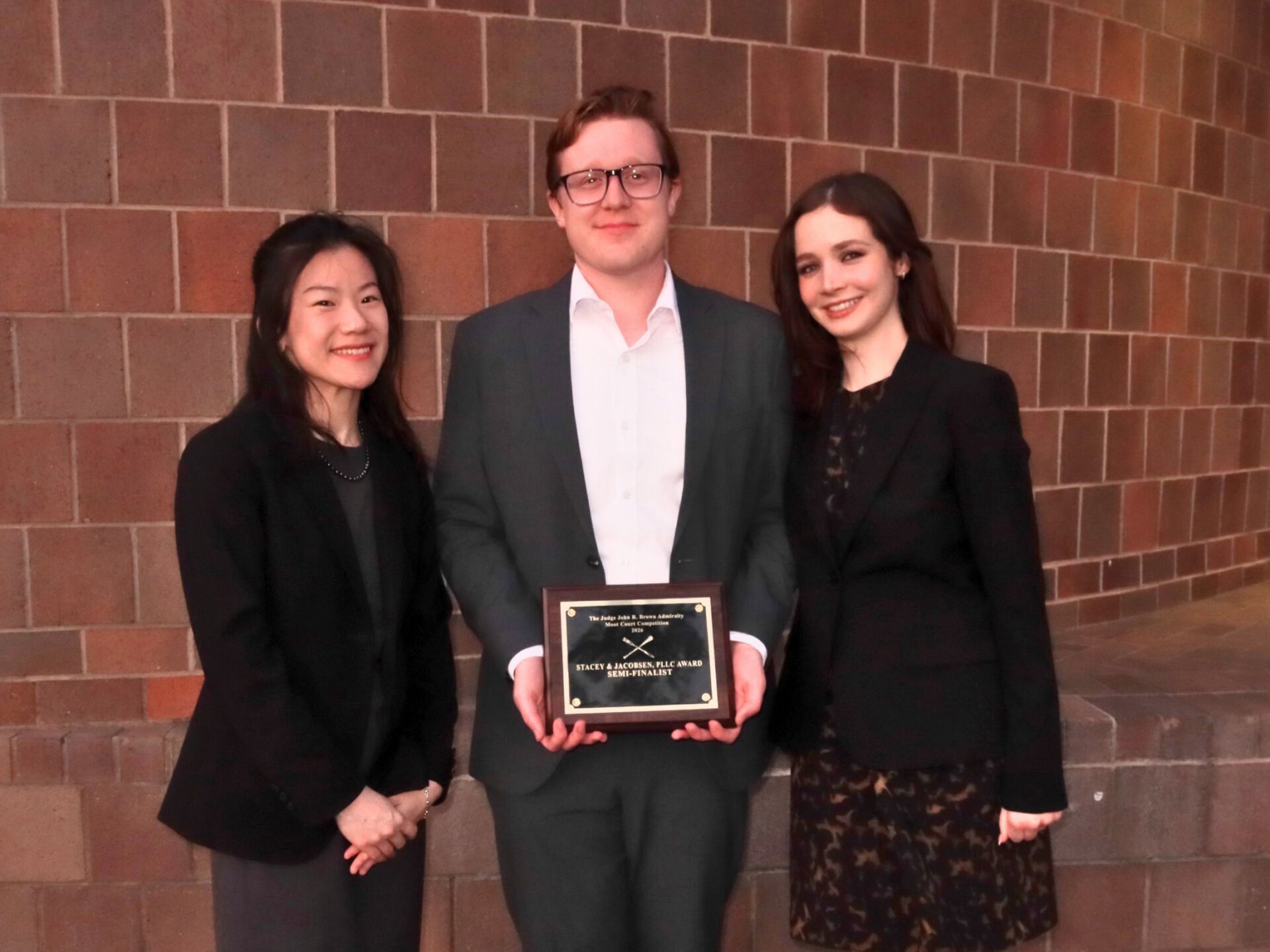 Photo of Anran Wang, Riley Anderson, and Rose Kresta at the Judge John R. Brown Admiralty Moot Court Competition