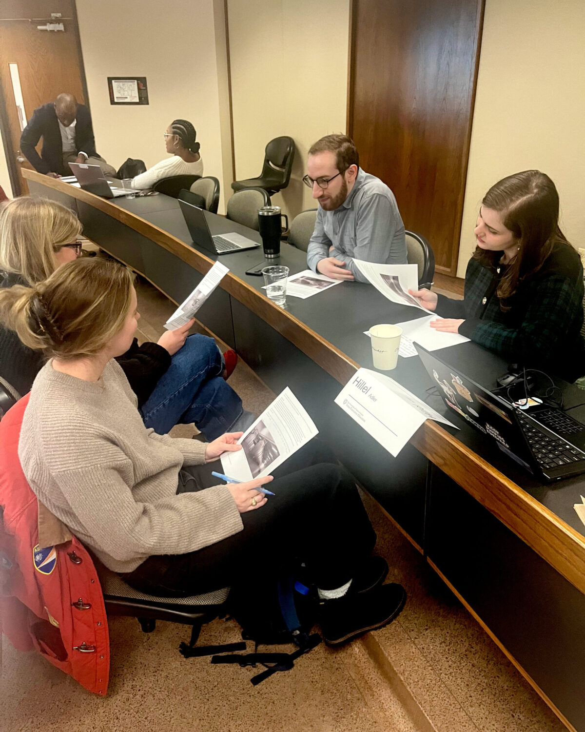 Students Katelyn Garcia, Hillel Adler, Sydney Moore, and Meredith Dickson discuss a case study.