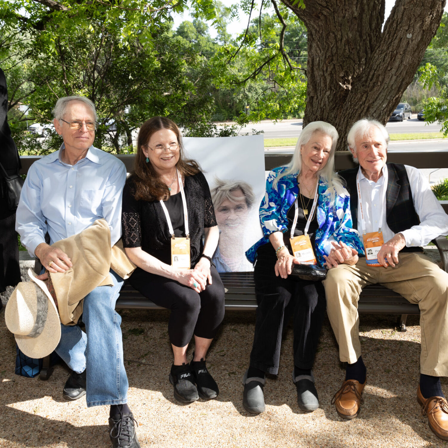 Friends of Jane Hayman '74, including Wendy and Doug John (right), gather to celebrate the dedication of the Friendship Bench on April 13, 2024.