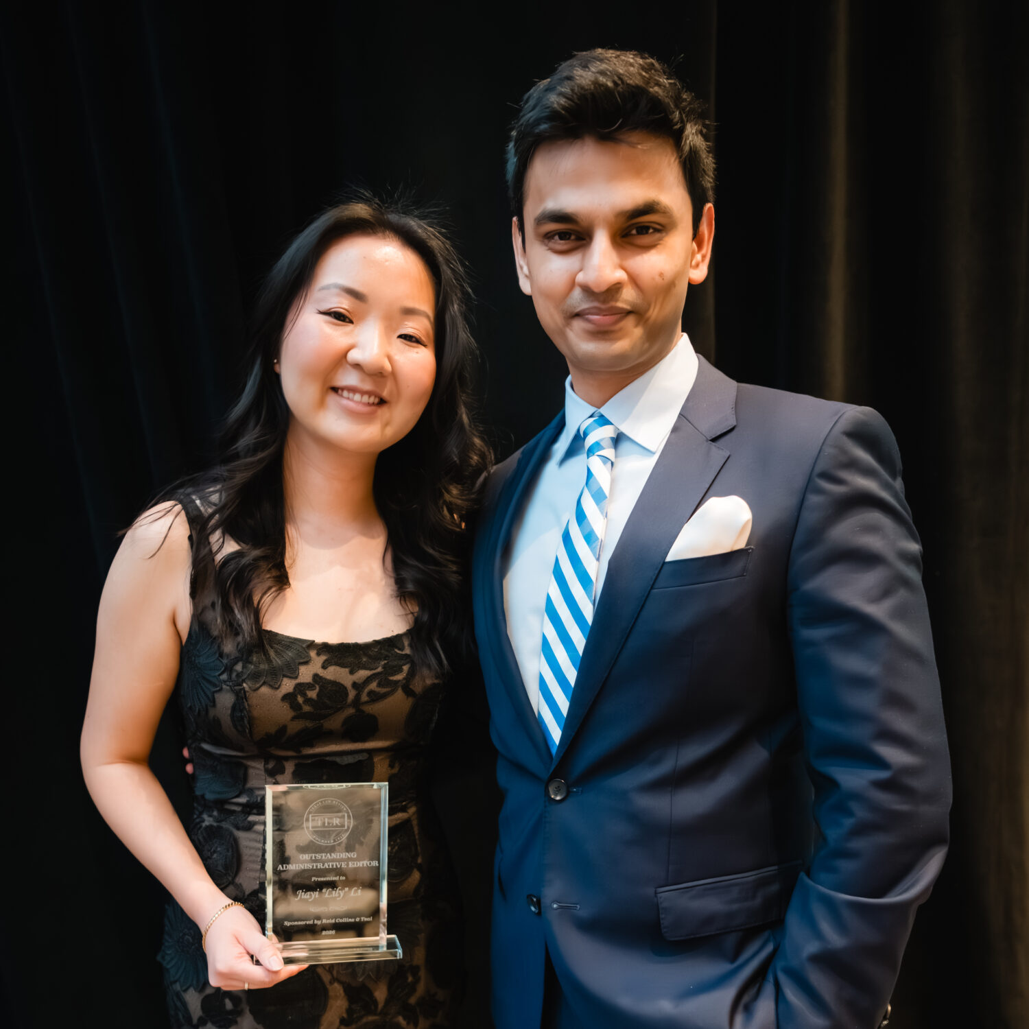 Lily receiving the Outstanding Administrative Editor Award for contributions to Texas Law Review and its community.