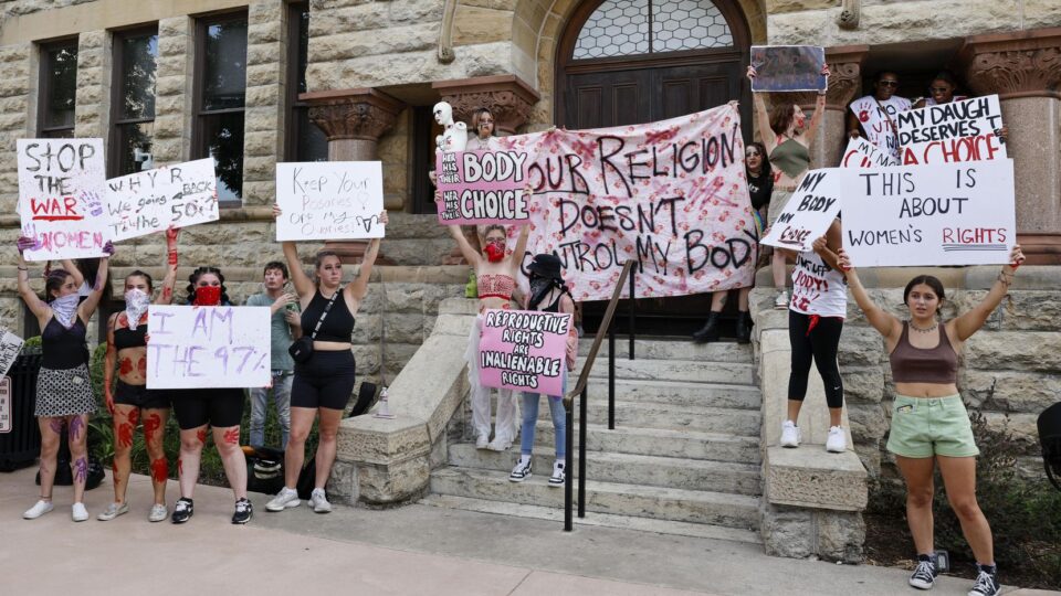 Abortion rights supporters gather outside the old Denton County Courthouse in Denton