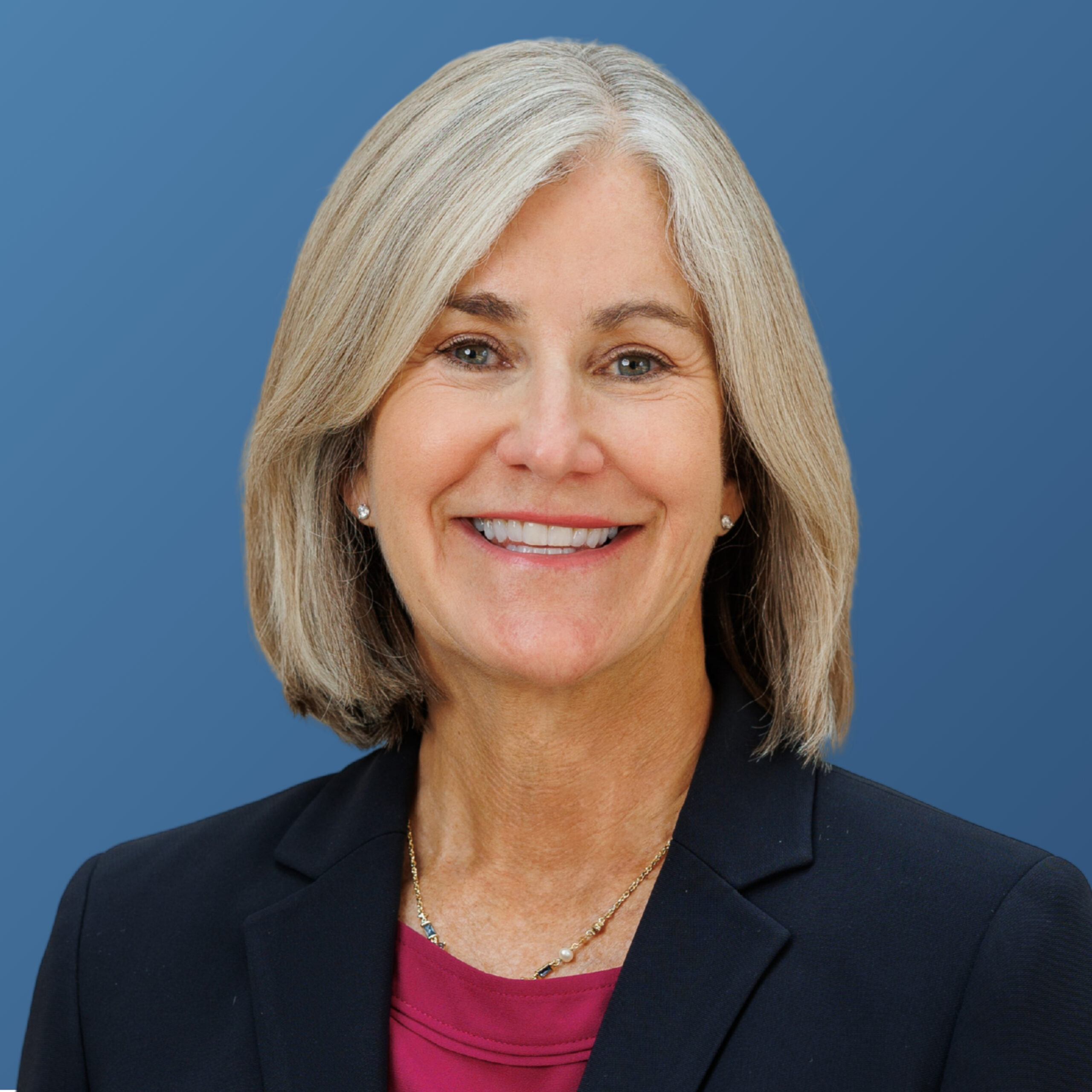 Melinda Taylor Headshot with Blue Background
