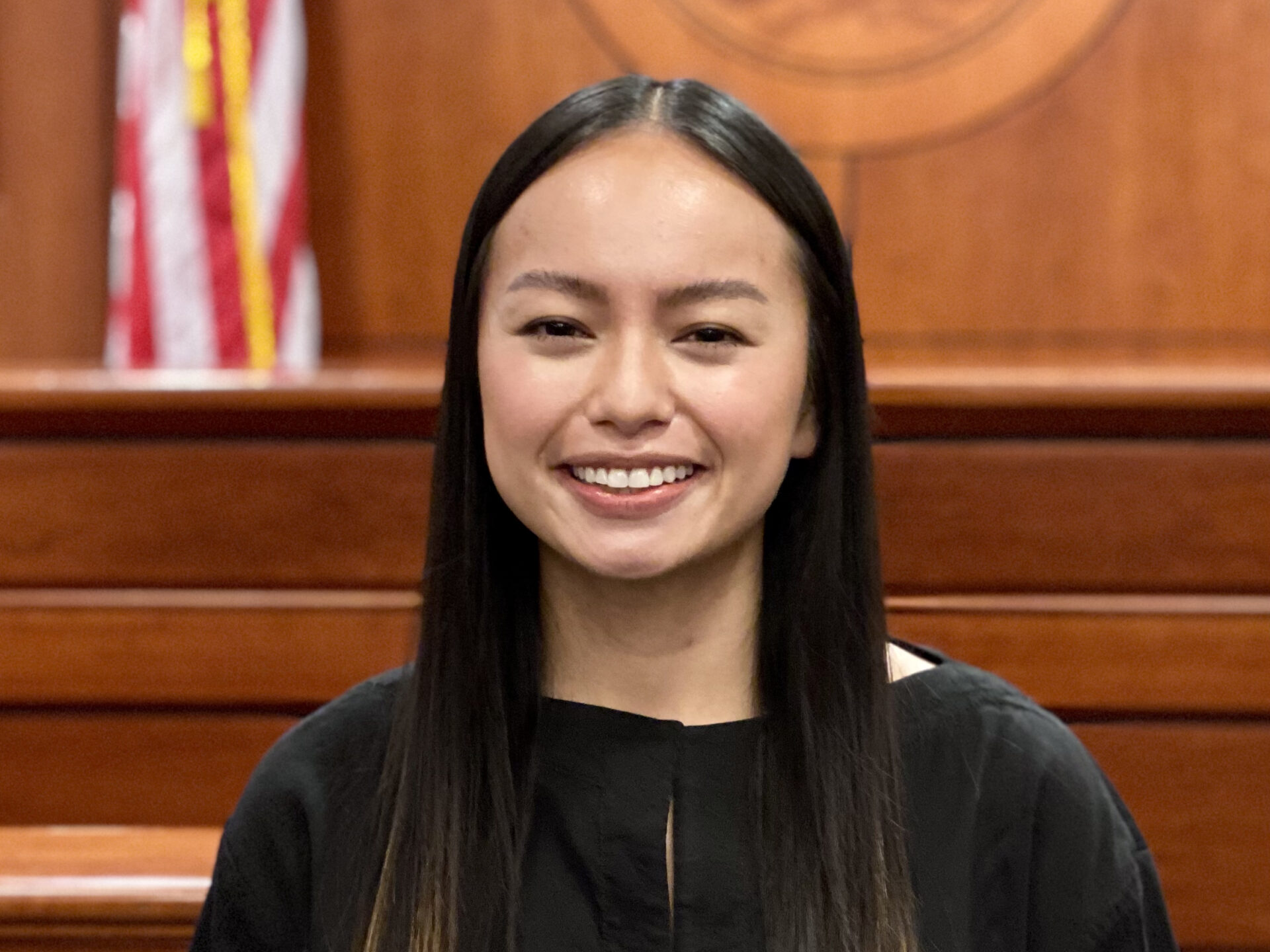 Portrait of Mimi Nguyen in a courtroom