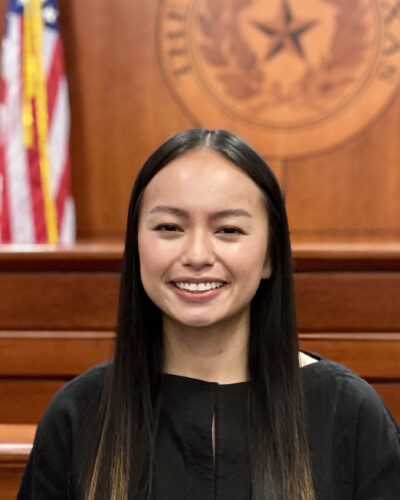 Portrait of Mimi Nguyen in a courtroom