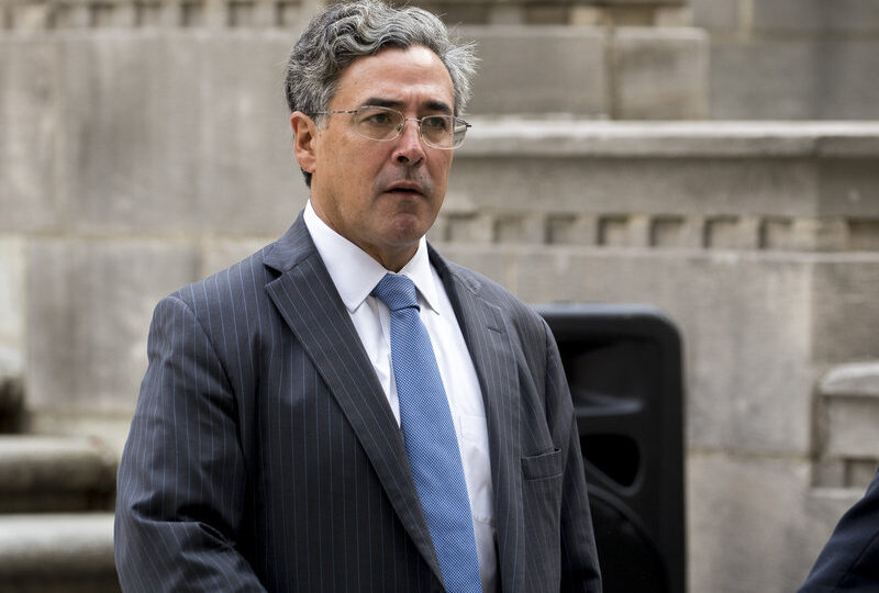 Solicitor General Noel Francisco at the Department of Justice wearing glasses and a blue tie.