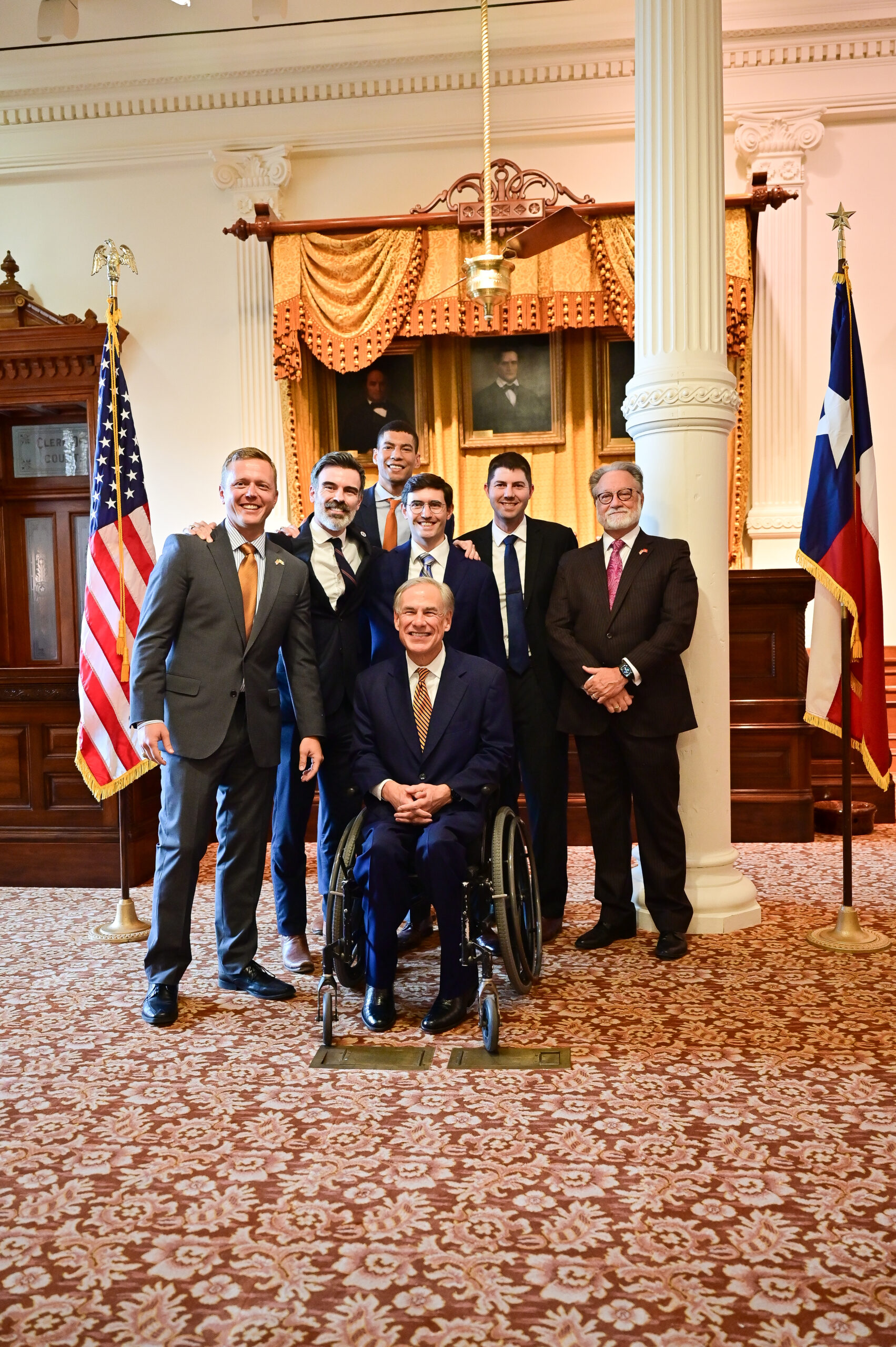 Six men stand in the office of Gov. Greg Abbott for a swearing in ceremony for new lawyers