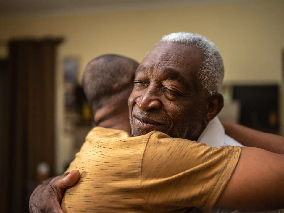 Parole Reform in Texas: photo of man hugging child