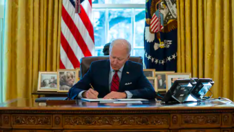 Biden signs a series of executive orders on health care, in the Oval Office of the White House.